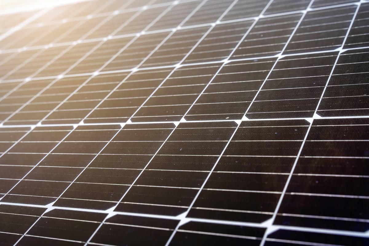 Close-up of dusty solar panels next to clean ones showing contrast in solar energy panel design effectiveness