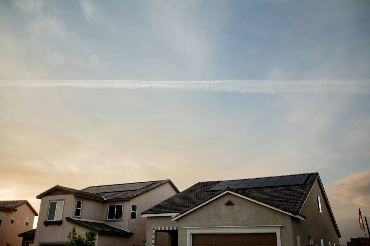 maintenance supply panel what energy is – technician using soft brush and deionized water to clean residential solar array